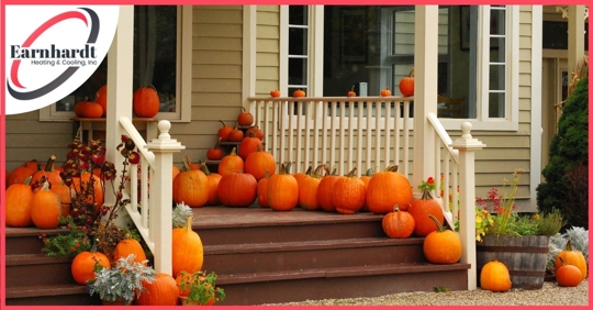 A home decorated with pumpkins for fall.